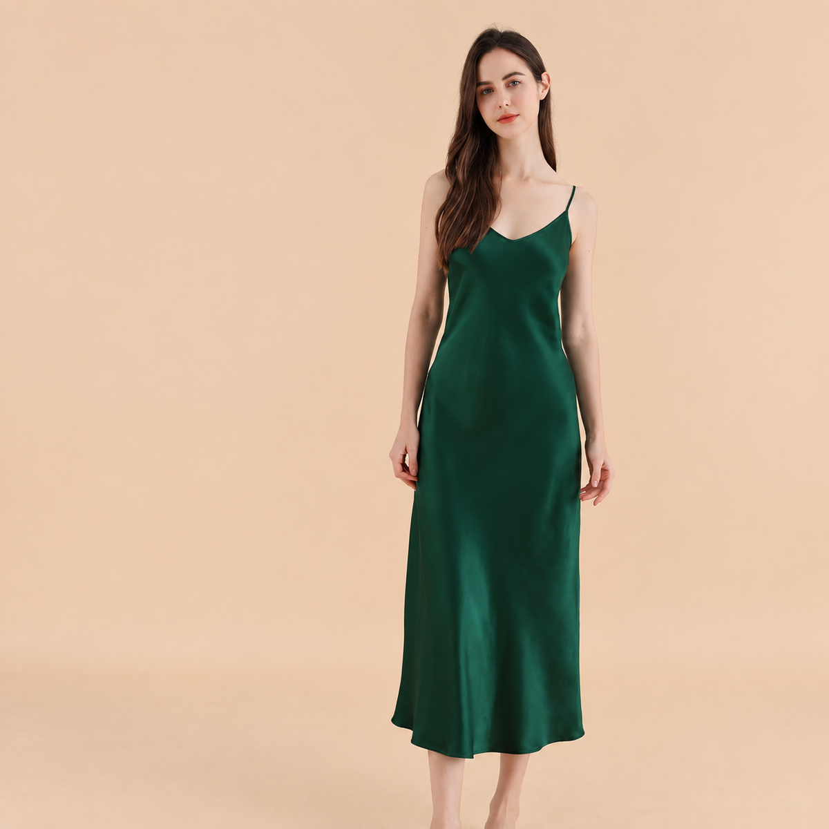 Model wearing emerald silk dress, Byserata Dresses