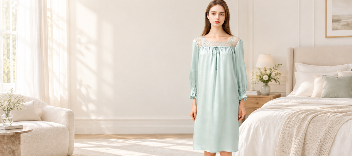Model wearing pale mint silk nightgown in a soft bedroom, Byserata Nightgowns