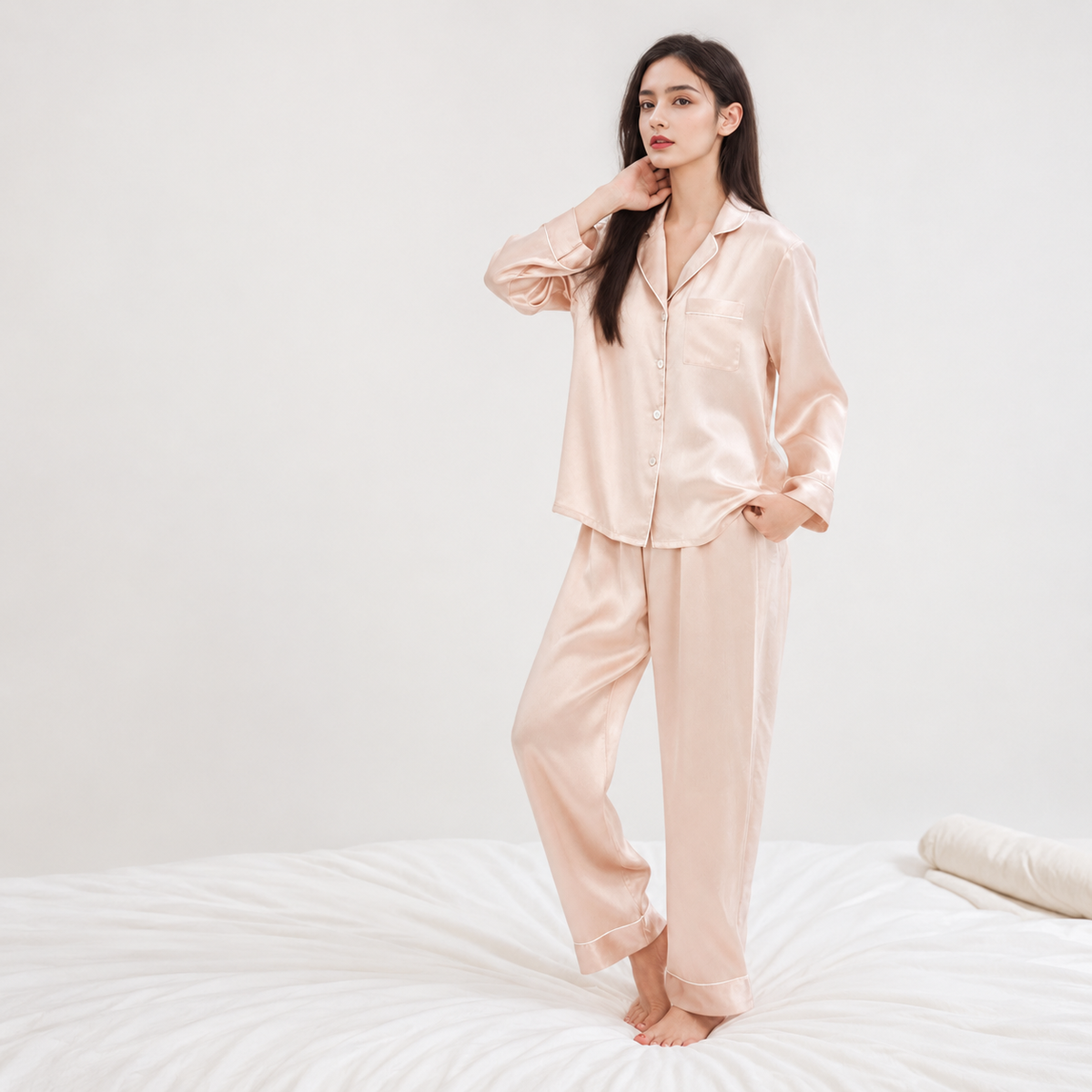 Model wearing pale pink silk pajama set, Byserata Pajama Sets